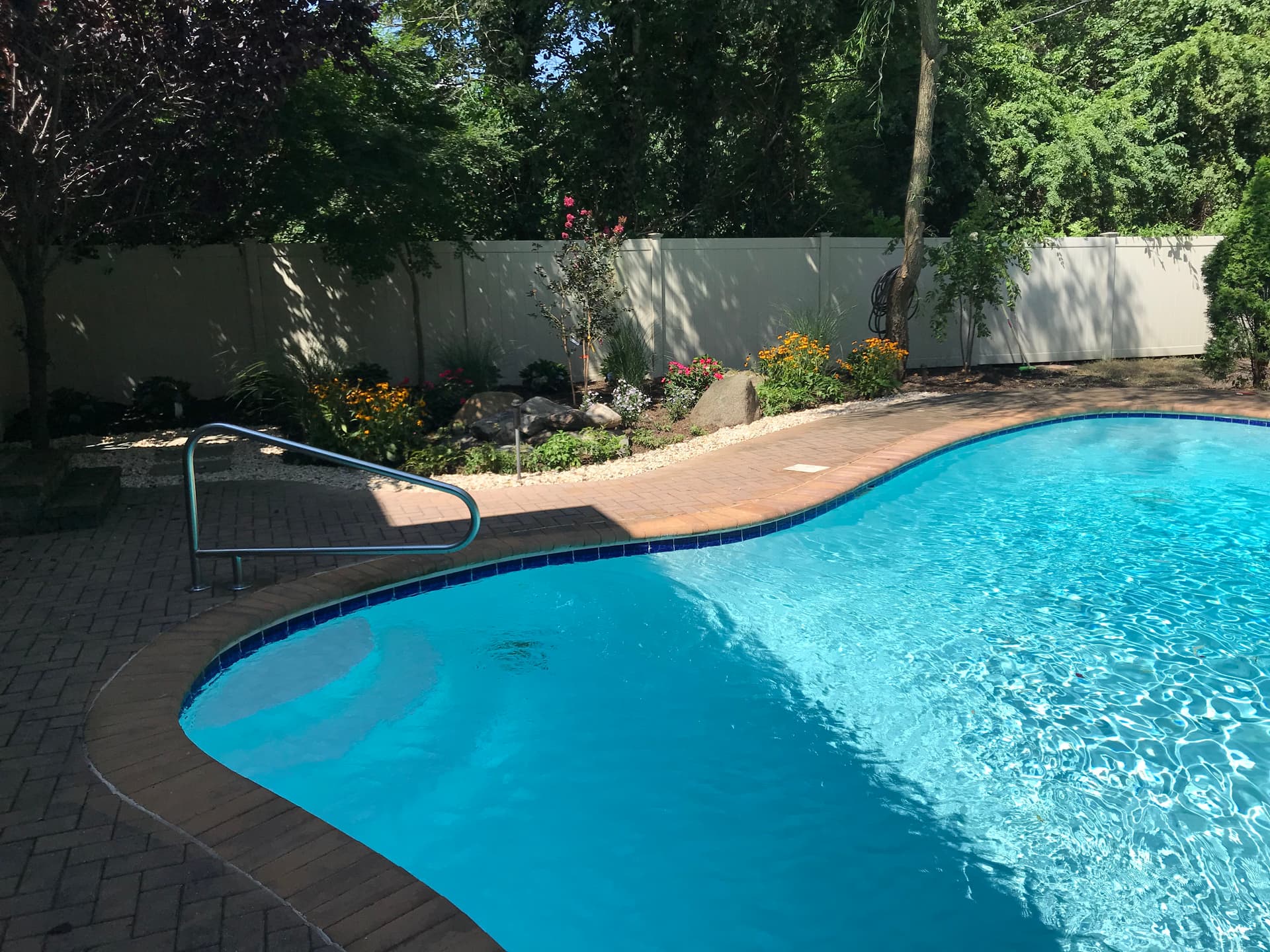 Backyard Makeover with Beautiful Poolside Landscaping