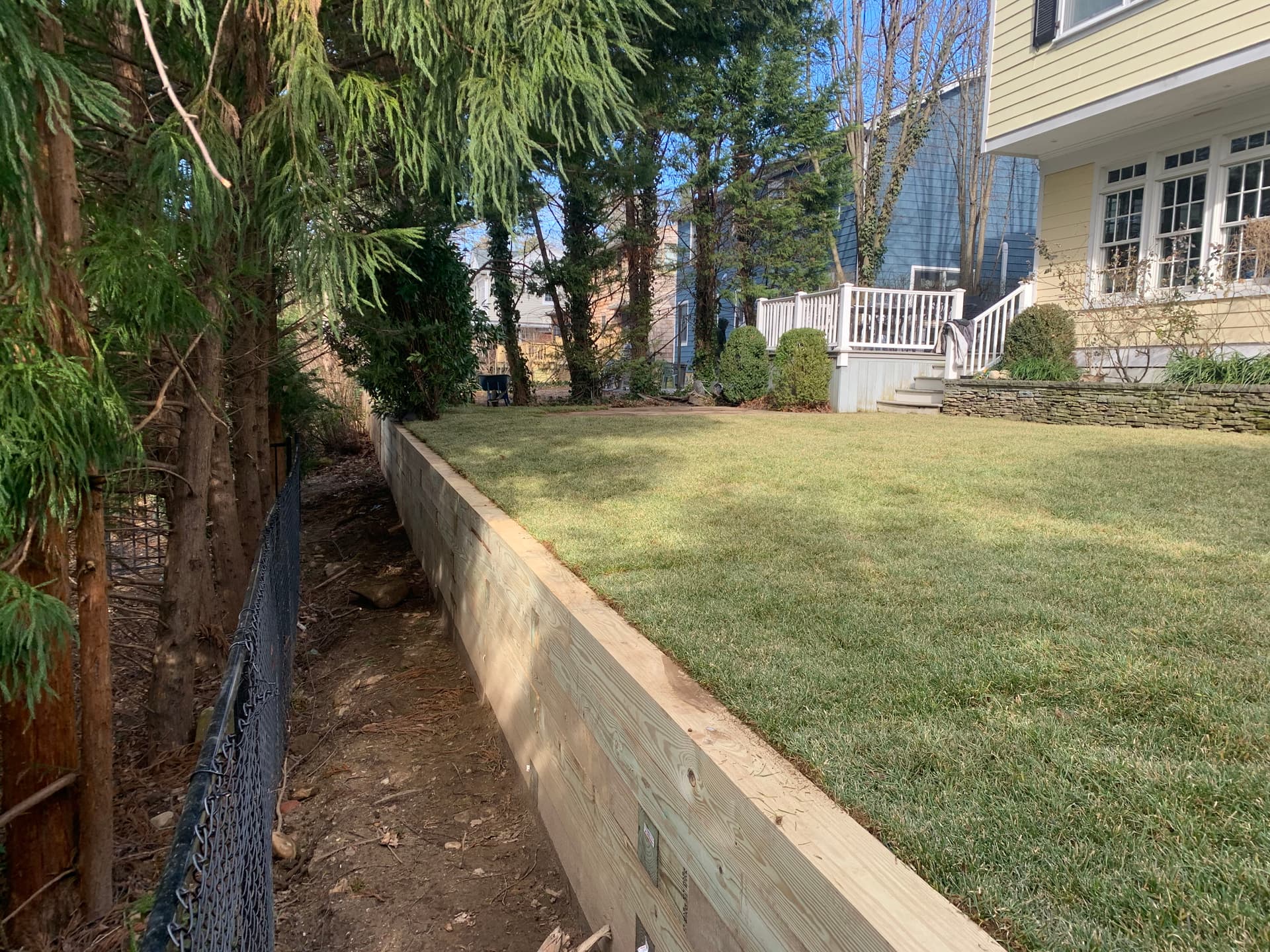 Failed Retaining Wall Replaced With Railroad Ties and Fresh Sod image